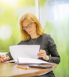 Professor Melanie Davies reading some papers